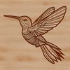 A colorful hummingbird in mid-air, its wings spread wide as it flies through a vibrant garden.