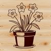 Ceramic Pot with Blooming Daffodil A single white daffodil bloom in a small ceramic flower pot on a natural stone background.