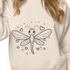 A colorful dragonfly with love hearts surrounding its body, depicted in vector format.