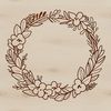 A decorative floral wreath made from interconnected flowers and leaves.