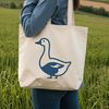 A white goose standing on a grassy field, suitable for commercial and personal use.
