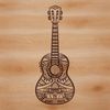 Intricately Carved Guitar SVG File A detailed illustration of an ornate guitar with intricate carvings.