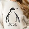 Cute Penguin Standing on Ice Illustration A black and white illustration of a penguin standing on ice, created as a vector graphic.