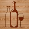 A wine bottle sitting on a table with a glass next to it.