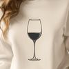 Glass Filled with Ruby Red Wine Wine glass filled with red wine on a wooden table.