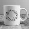 A floral SVG design of a decorative wreath with intricate details.