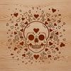 A stylized skull design featuring love hearts, suitable for use in crafting and DIY projects.