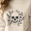A graphic illustration of a detailed skull with intricate designs.
