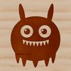 A colorful illustration of a cute monster face with cartoon-style features.