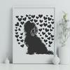 A sitting Havanese dog with hearts around it.