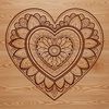 An SVG vector illustration of a stylized love heart with symmetrical mandala elements.