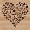 A simple heart shape with ornate details, suitable for crafting and DIY projects.