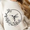 Floral Bird Design Vector Art An illustration of a hummingbird surrounded by flowers in a detailed vector design.