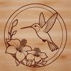 Illustration of a hummingbird surrounded by foliage, created as a scalable graphic design element.