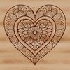 A vibrant mandala design featuring a heart shape at its center, created as a scalable vector graphic.