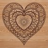 A decorative mandala design featuring a stylized heart shape, suitable for digital crafting and cutting machines.