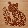 A sitting big cat with spotted fur, native to the wild.