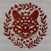 A close-up illustration of an ocelot's head with ornate floral patterns surrounding it.