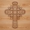 An intricate design of a Christian religious symbol featuring a decorated cross.