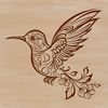 A colorful hummingbird in mid-flight, surrounded by delicate floral patterns.