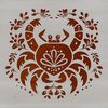 A stylized illustration of a crab with ornate floral details.