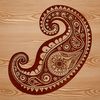A stylized, ornate paisley design featuring intricate shapes.