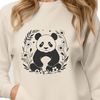 A black and white illustration of a panda in a floral setting.