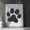 Graphic design element featuring a single animal paw print with clean lines and simple shape.