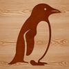 Penguin Silhouette on Coastline A penguin standing on rocky coastline.