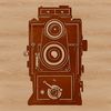 A sleek camera icon with metallic textures and futuristic design elements.