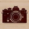 Free Digital Camera SVG Clip Art A sleek digital camera with a lens and shutter, depicted in a simplified vector design.