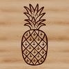 A sliced pineapple on a tropical beach with a palm tree in the background.