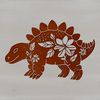 A stylized illustration of a prehistoric dinosaur surrounded by simple floral patterns.