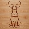 Cute Cartoon Bunny Vector Art A cartoon rabbit sitting on its haunches, designed as a vector graphic suitable for digital cutting machines like Cricut.