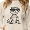 Fun Lizard Silhouette in Sunglasses A cartoon lizard wearing trendy sunglasses sits on a rock in the desert.