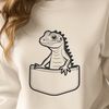 Lizard Peeking Out from Pocket A reptile animal peeking out from behind a small pocket.