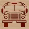 A white school bus with a blue stripe driving down a road on a sunny day.