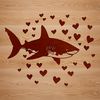 A colorful illustration of a shark with love hearts surrounding its body.