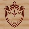 A stylized shield design with ornate details.