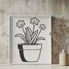 Elegant White Daffodil in a Green Pot A single white daffodil flower growing in a green pot with yellow petals.