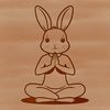 A simple illustration of a sitting rabbit with bold lines and minimal details.