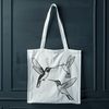 Free Hummingbird Silhouette A digital illustration of a hummingbird in flight, depicted as a vector graphic.