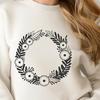 A hand-drawn floral wreath design made in vector format for easy editing and customization.