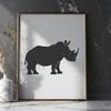 Wildlife Safari Animal Silhouette Vector Graphic A large, gray mammal with a distinctive horn on its nose, standing in a natural savannah environment.