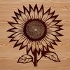 A large, bright yellow sunflower with dark center petals, growing in a garden or field.