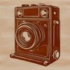 A digital camera icon featuring a minimalist design with clean lines and simple shapes.