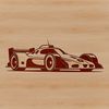 An SVG vector graphic illustration of a speeding racing vehicle on the track.
