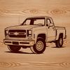 A graphic representation of a rugged pickup truck with a cargo bed and cab.