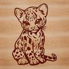 A sitting big cat with distinctive markings and a wild appearance.