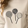 Layered Lollipop Graphic A stylized design featuring a lollipop made from layered candy colors.